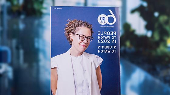 2023年2月的《菠菜台子大全》印刷版.封面上是一位面带微笑的设计师，旁边写着“2023年值得关注的人物:值得关注的学生”.”